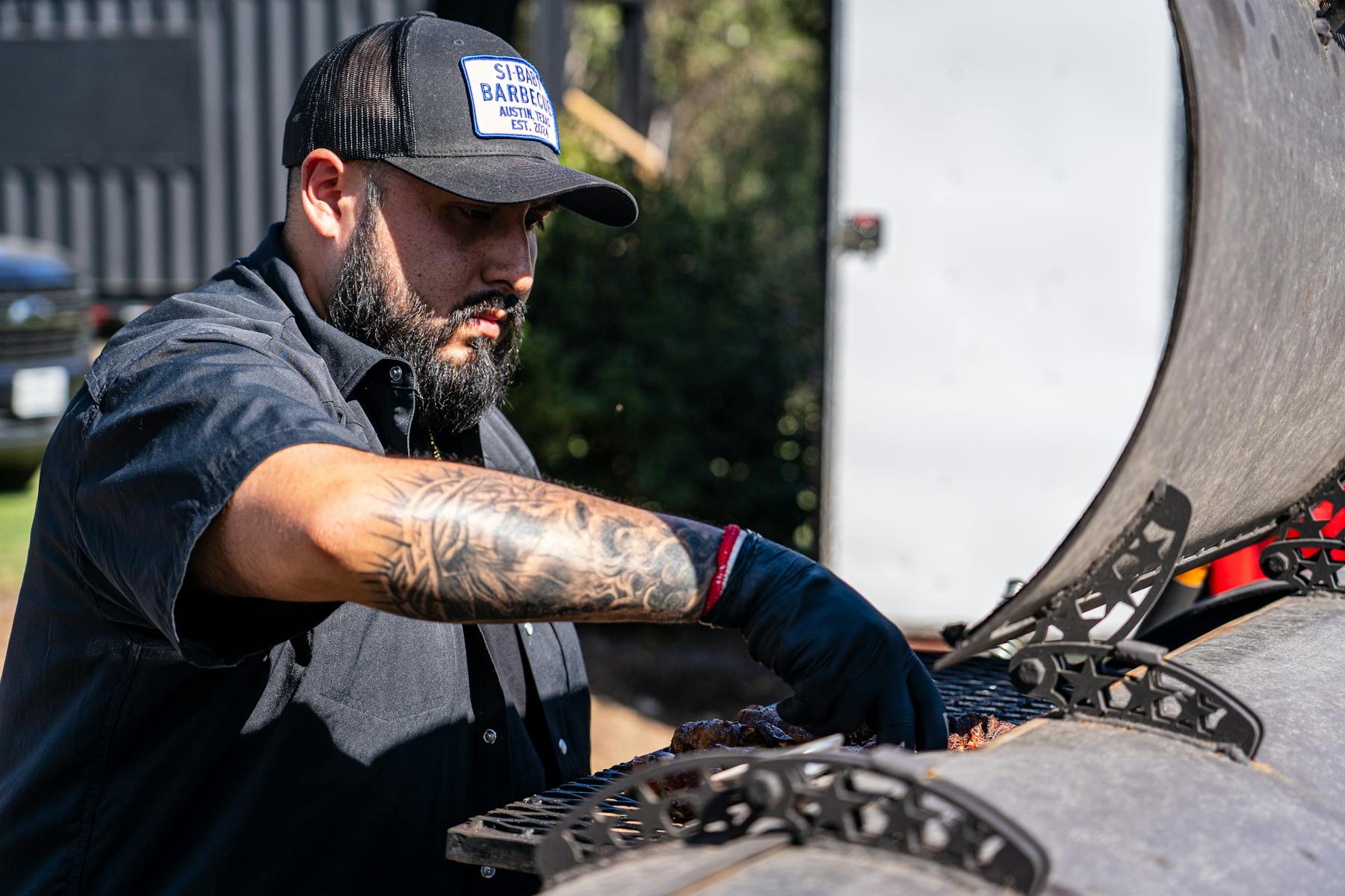 Pitmaster Jonathan Lagos at the smoker